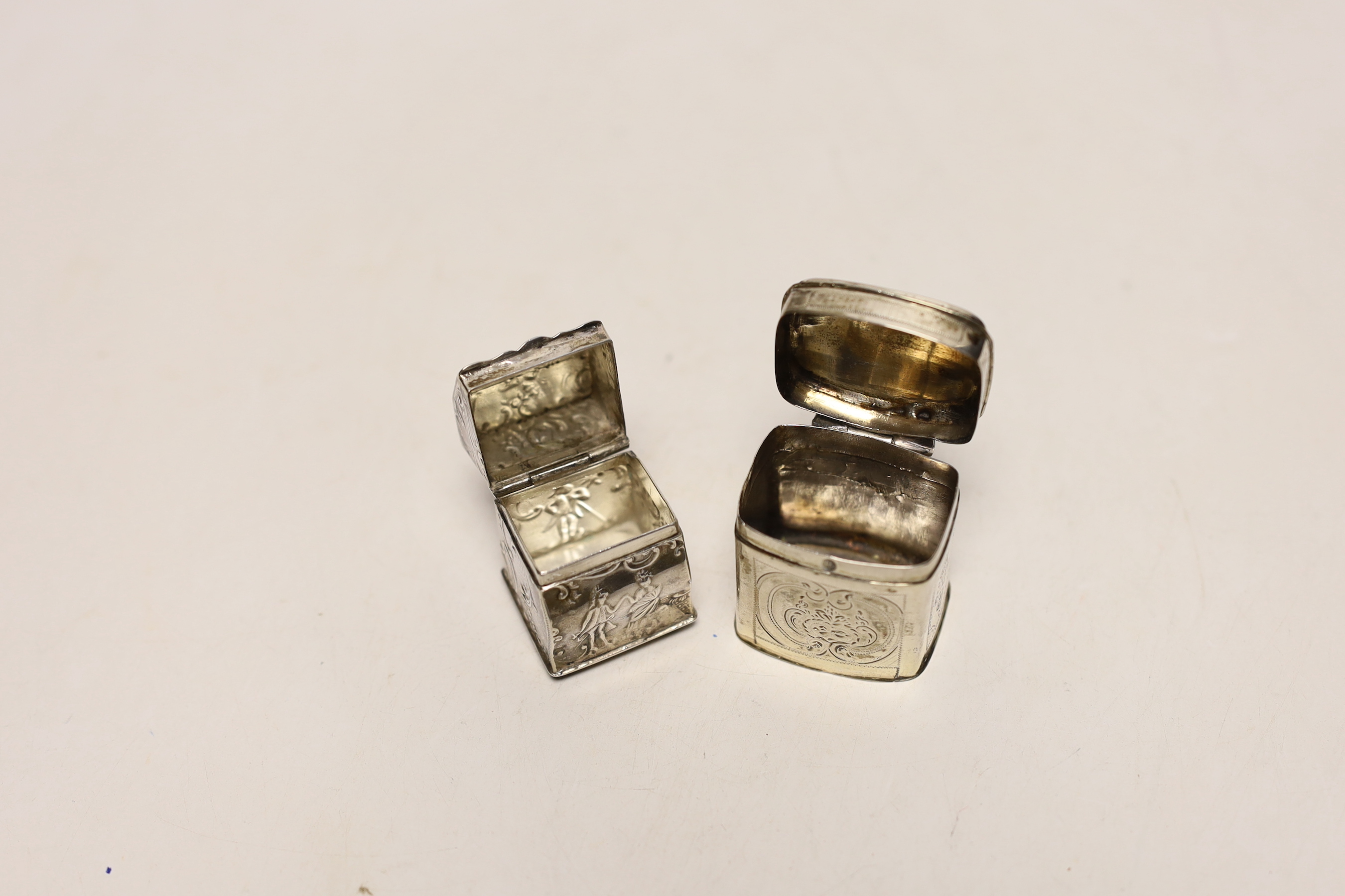 Two 19th century Dutch white metal snuff boxes, one of bureau form, on ball feet, 39mm.